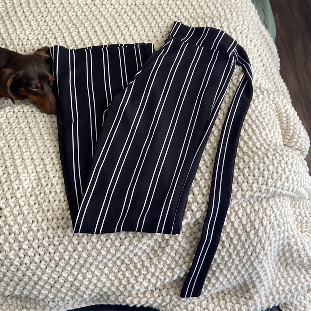 Black and white striped pants.